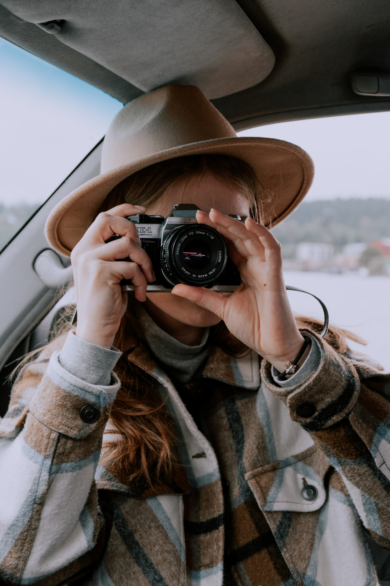 Woman in the Car Taking Photos